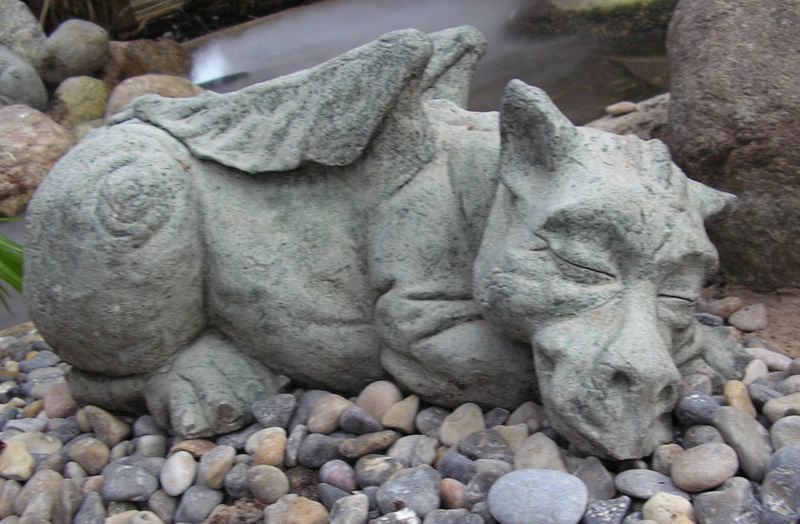 A sleeping gargoyle (dragon) a garden ornament by Liftarn